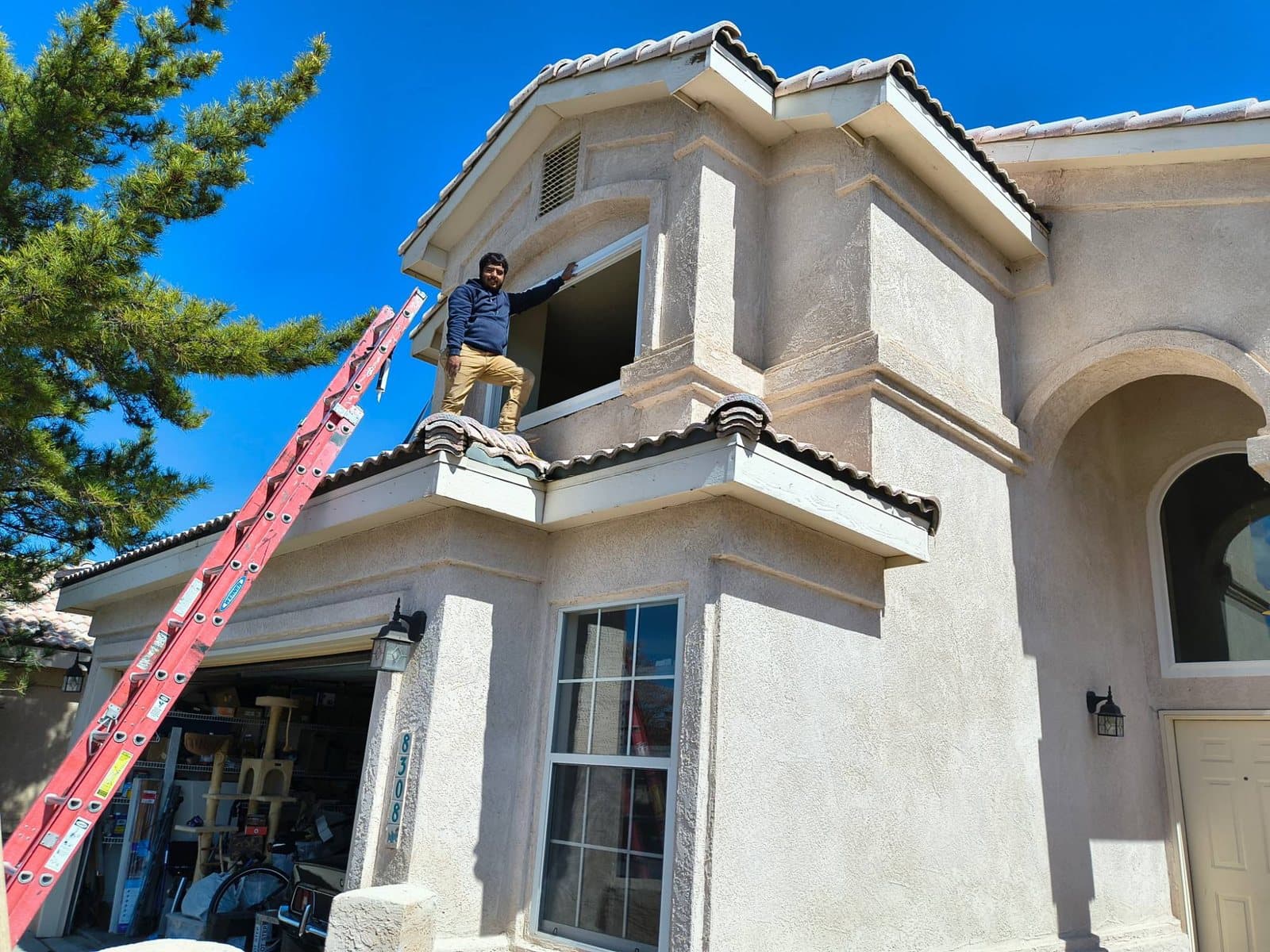 Iron Sight installer completing an upper-story window install